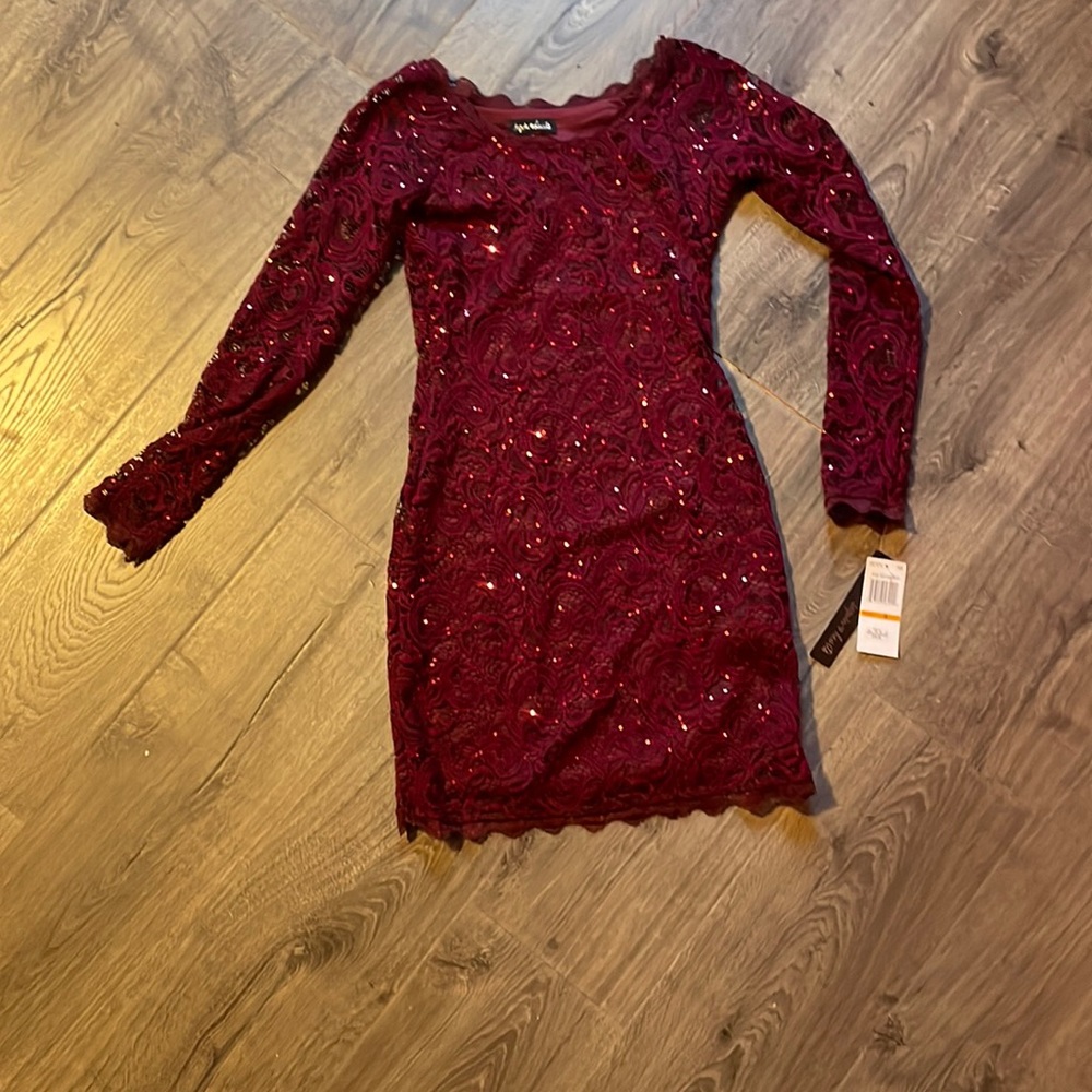 The brand is sequin hearts  dress